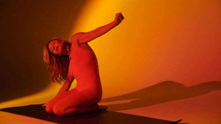 Woman practicing a Soul Body Scan in a serene setting.